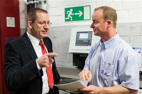Kaeser Kompressoren engineer Hages and ZF Friedrichshafen employee Baumgarten discussing the compressed air station plans