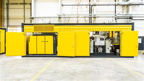 Open compressed air container showing rotary screw compressors from Kaeser Kompressoren.